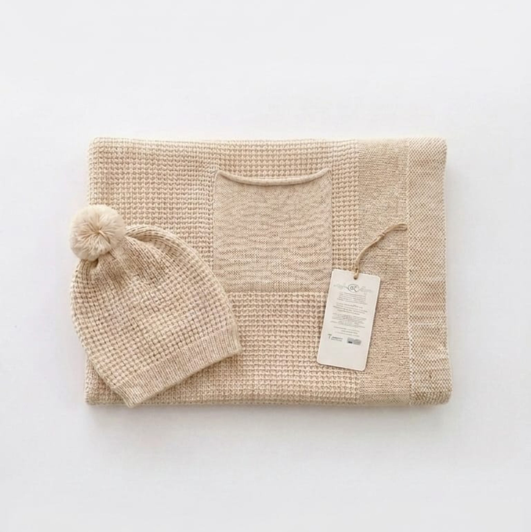 Single-layer knit blanket with a beanie and pocket