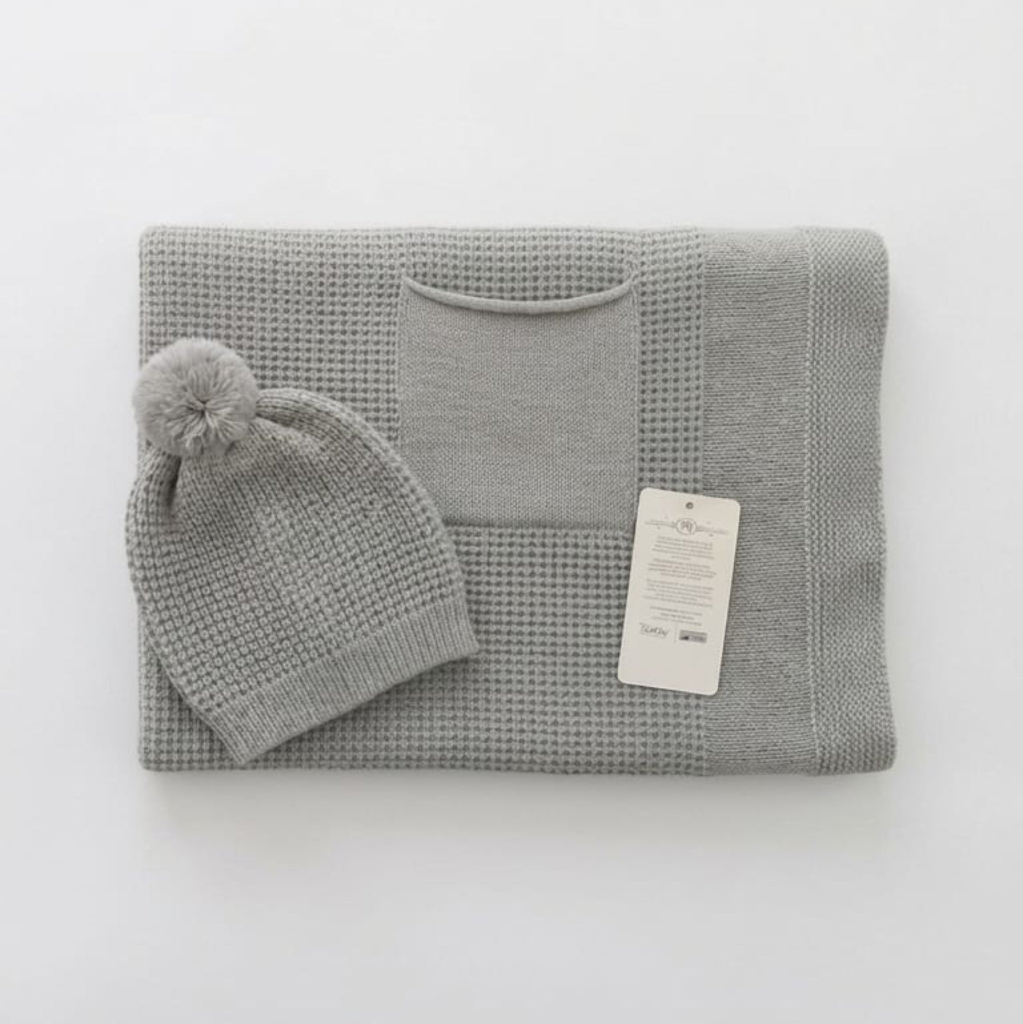 Single-layer knit blanket with a beanie and pocket