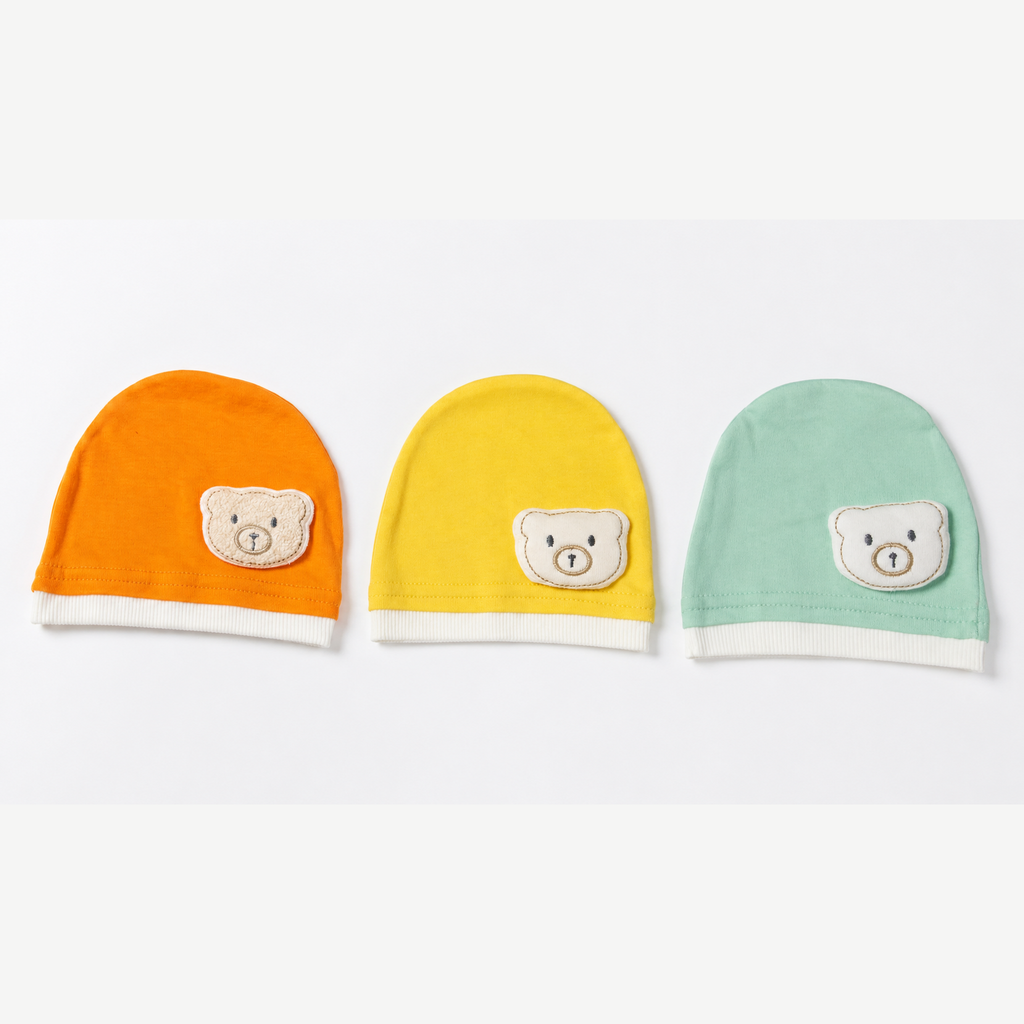 Collection of 3 newborn cotton beanies with teddy bear