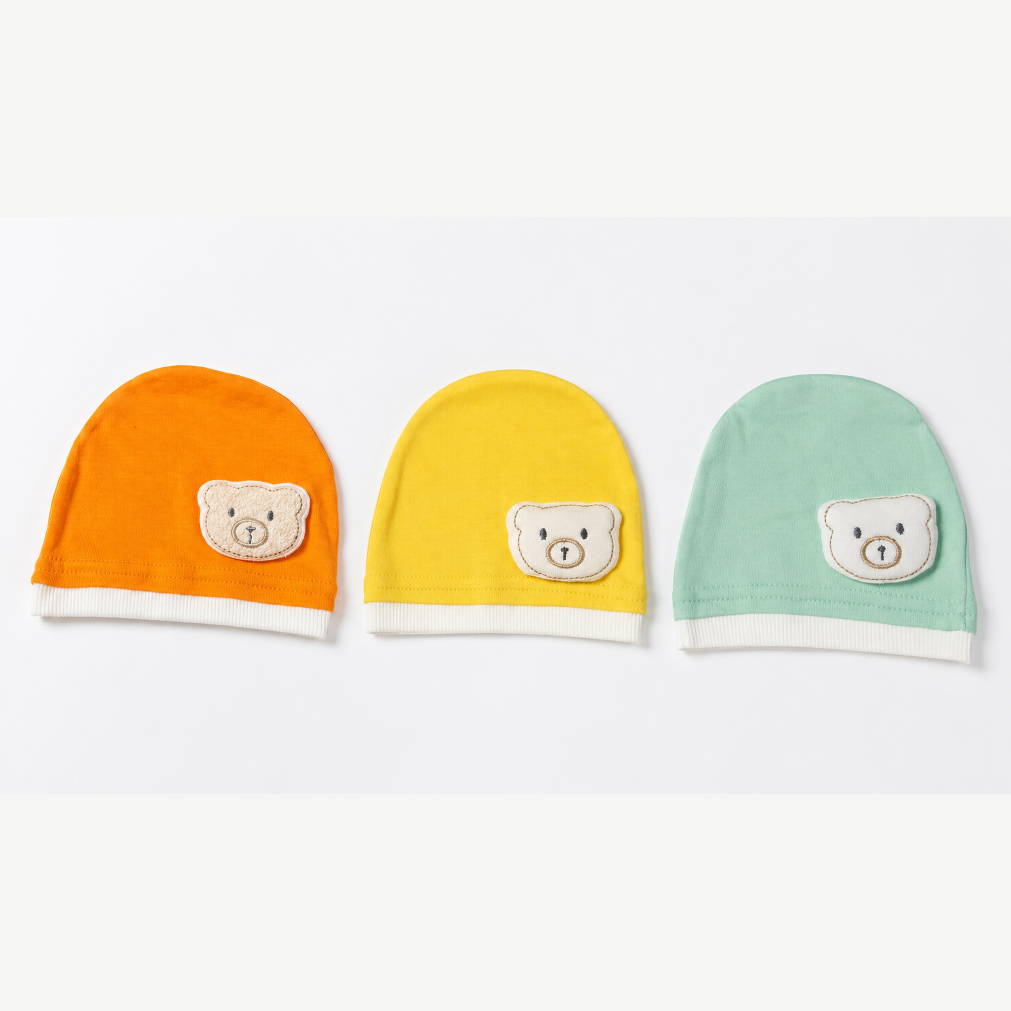Collection of 3 newborn cotton beanies with teddy bear
